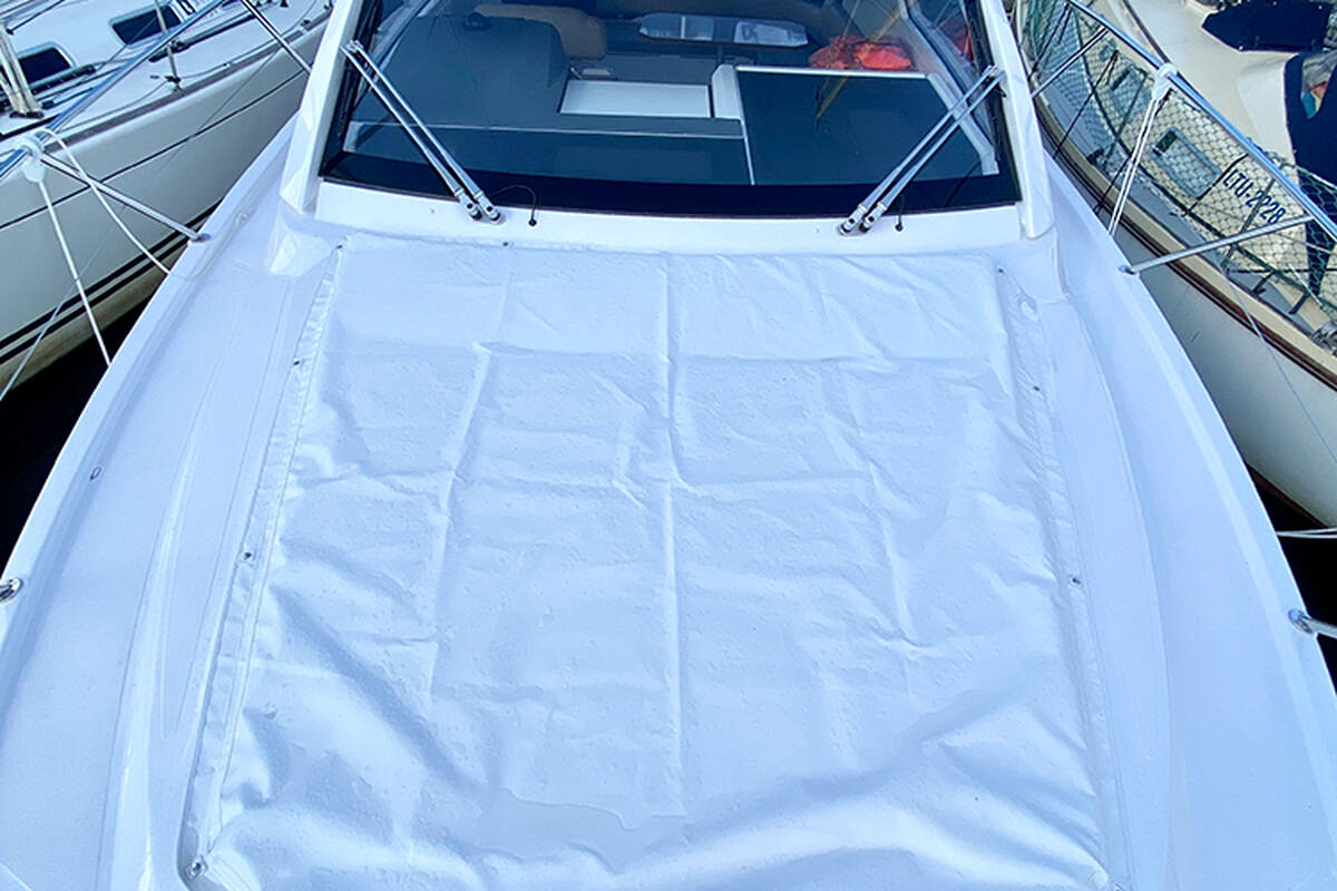 Sunbathing cushions on bow with covers